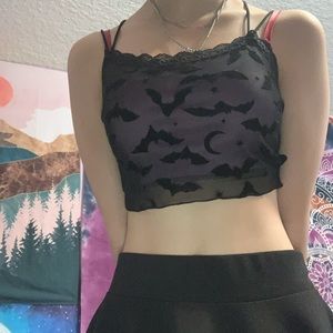 Purple and black right crop top w bats on it